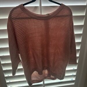 Baby pink high-low sweater with buttons on back.